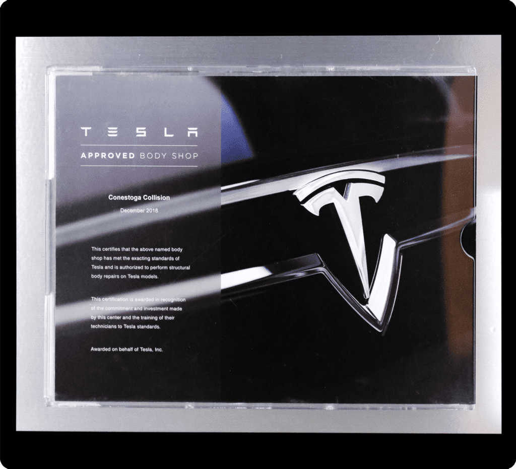 Tesla Approved body shop Image of the certificate that say Conestoga Collision is a Tesla approved body shop